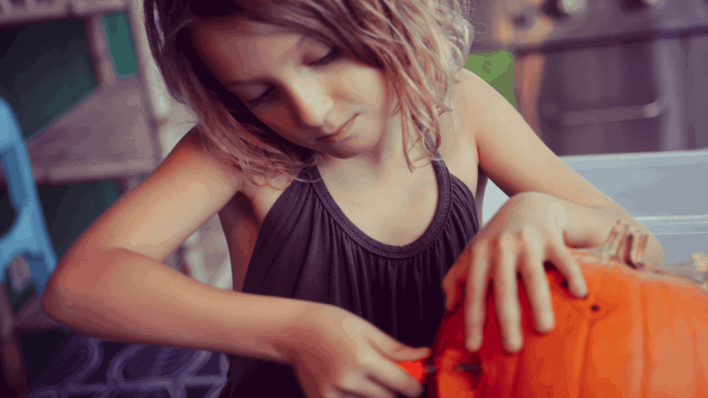 Girl Carving Pumpkin