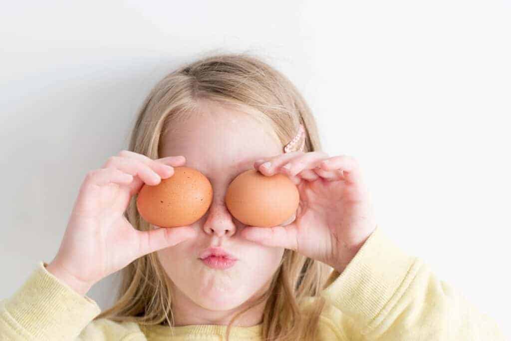 Kid being playful with food ingredients.